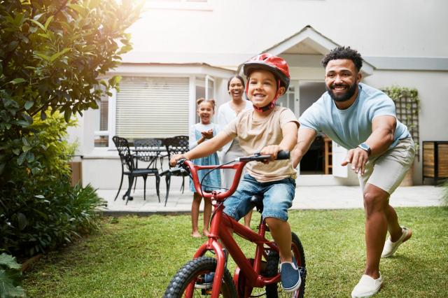 Father and child riding bike